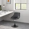 A swivel chair is placed next to a desk in an office or home office setting. Náhľad obrázku produktu