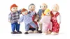 A group of wooden dolls representing a family, posed against a white background. Anteprima dell’immagine prodotto
