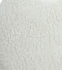 A close-up texture shot of a beige faux fur rug. Produktbild-Vorschau