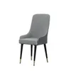 A single gray dining chair with black legs and gold accents on a white background. Produktbild-Vorschau