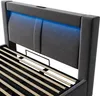 Close-up view of a bed frame's headboard with integrated LED lighting and the slatted base. Produktbild-Vorschau