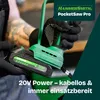 A person wearing black gloves is holding a green and black cordless mini chainsaw with a battery attached. Produktbild-Vorschau