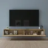 A wall-mounted TV cabinet with a television above it, set against a blue wall and on a wooden floor. Produktbild-Vorschau