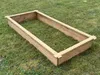 A wooden raised garden bed is placed on a grassy lawn. Produktbild-Vorschau