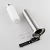 A disassembled outdoor light fixture, including the stainless steel housing, a white diffuser, screws, and wall plugs, laid out on a light gray surface. Anteprima dell’immagine prodotto