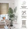 A living room scene featuring a bamboo roller blind, large potted plants, and modern furniture, with text overlays highlighting product features. Voir les images du produit