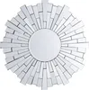 A sunburst mirror with a central circular mirror and radiating glass pieces. Náhľad obrázku produktu