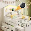 A child's bed with storage drawers and a headboard with LED lighting and a USB charging port. Anteprima dell’immagine prodotto