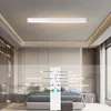 A modern bedroom with a ceiling light and a remote control overlay. Náhled obrázku produktu