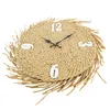 A round wall clock made of woven straw with white numbers and black hands, set against a white background. Podgląd zdjęcia produktu