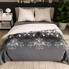 A bed with a duvet cover and pillows. Produktbild-Vorschau