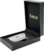 A silver Ronson lighter is displayed in its black presentation box. Náhled obrázku produktu