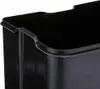 A close-up view of the top rim of a black trash can. Voir les images du produit