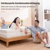 A couple relaxing on a bed with a mattress. Produktbild-Vorschau