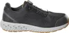A side view of a black safety shoe with a gray sole and orange accents. Produktbild-Vorschau