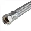 A close-up shot of a braided metal hose with a threaded fitting. Produktbild-Vorschau