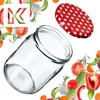 A glass jar and its lid are shown with various vegetables and herbs scattered around them. Anteprima dell’immagine prodotto