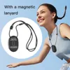 A woman is running outdoors with a small black device attached to a lanyard around her neck. Náhled obrázku produktu