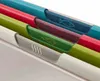 A close-up view of a set of four colorful cutting boards, each with a different icon indicating its intended use. Podgląd zdjęcia produktu