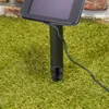 A close-up shot of a solar-powered light string stake in the grass. Produktbild-Vorschau