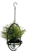 A hanging planter with a green artificial plant inside, suspended by a black chain against a white background. Anteprima dell’immagine prodotto