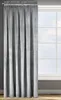 A gray curtain hangs in front of a window. Produktbild-Vorschau