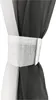 A close-up of a curtain tie-back holding together two sheer curtains, one white and one dark gray, with a gradient effect. Produktbild-Vorschau