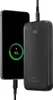 A black power bank is charging a black smartphone. Náhľad obrázku produktu