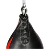 A close-up view of the top of a black speed bag with red accents, showing the lacing and the attachment point to a metal rod via a rope. Anteprima dell’immagine prodotto