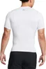 A person wearing a white short-sleeved compression shirt. Produktbild-Vorschau