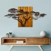 A metal tree sculpture mounted on a wooden panel, displayed above a wooden console table with decorative items. Anteprima dell’immagine prodotto
