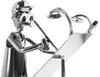 A metallic figurine of an architect working on a blueprint. Náhled obrázku produktu