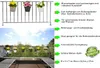 A balcony with hanging flower pots and a view of the sky and trees. Produktbild-Vorschau