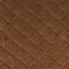 A close-up of quilted brown fabric. Anteprima dell’immagine prodotto