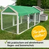 A wooden chicken coop with a green tarp roof, set up on a grassy lawn. Produktbild-Vorschau