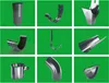 A collage of various gutter and downspout components against a green background. Produktbild-Vorschau