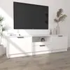 A white TV stand with a TV mounted above it, in a room with a plant and decorative items. Náhľad obrázku produktu
