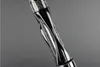 Close-up of a twisted handle with carbon fiber pattern and chrome accents. Produktbild-Vorschau