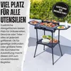 An electric grill with food and serving dishes on a patio. Produktbild-Vorschau