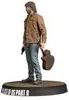 A figurine of a man holding a guitar and a gun, standing on a circular base. Podgląd zdjęcia produktu