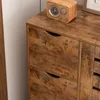 A close-up view of a wooden dresser with three drawers, featuring a vintage radio on top. Podgląd zdjęcia produktu