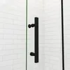 A black shower door handle against a white tiled wall. Produktbild-Vorschau