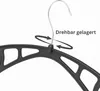 A close-up of a black plastic hanger with a silver hook, against a white background. The hanger's hook is shown to be rotatable, indicated by arrows and text. Produktbild-Vorschau
