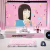 A pink-themed gaming setup featuring a computer monitor displaying anime, a pink mechanical keyboard, a white controller, and other accessories. Produktbild-Vorschau