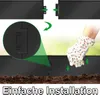 Close-up of a gloved hand installing a black garden border into soil, with an inset showing the connection mechanism. Voir les images du produit