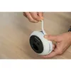 Hands holding a white Blaupunkt power strip with USB ports, with a white cable being pulled out. Produktbild-Vorschau