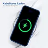 A smartphone is placed on a wireless charger, showing a charging animation on its screen. The phone is in a blue case. Produktbild-Vorschau
