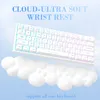 A white keyboard rests on a cloud-like wrist rest, with text overlaying a blue sky background. Podgląd zdjęcia produktu