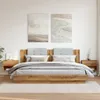 A bedroom setting with a bed and nightstands. Produktbild-Vorschau