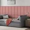 A modern living room scene featuring a sofa with decorative wall panels behind it. Anteprima dell’immagine prodotto